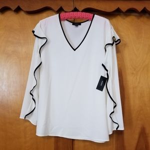 White with black trim blouse.